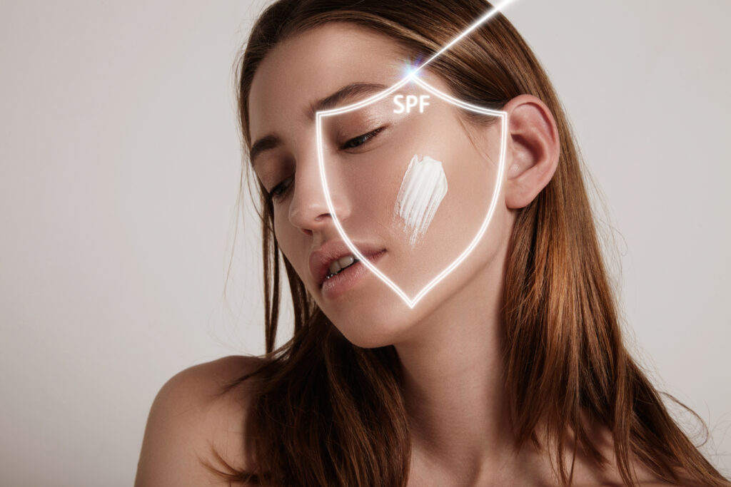 A radiant image featuring a woman applying sunscreen, symbolizing sun protection. The sun-kissed glow and the protective shield of SPF convey the importance of safeguarding the skin care routine against harmful UV rays.